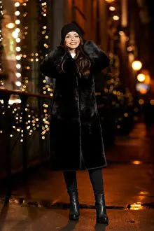 Curls Prints: Fashionable stylish woman in black fur coat walking at city street at night