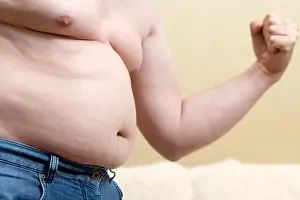 Gymnastic Prints: Fat funny man in jeans shows his biceps