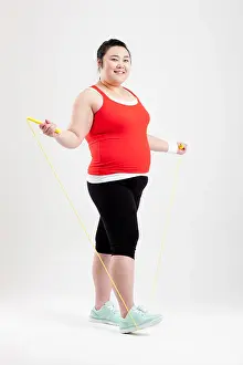Korean Ethnicity Prints: a fat girl in a gym outfit holding a skipping rope