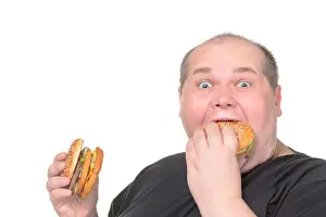 Fastfood Prints: Fat Man Greedily Eating Hamburger, on white background