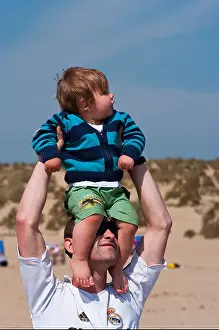 Beachfront Prints: Father Holding Baby Son Above His Head