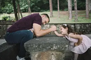 Love Together Prints: Father and his little daughter wrestling with arms