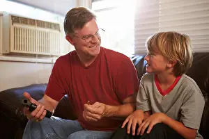Forties Prints: Father Showing Son How To Use Gun At Home