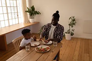 Homey Prints: Father and son having pizza at home