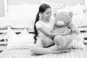 Pajamas Prints: Favorite toy. Girl child hug teddy bear in her bedroom