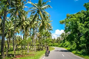 Dense Prints: Female cyclist cycling in Sumbava island, Indonesia