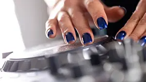 Skill Prints: female DJ hands on a DJ modern console