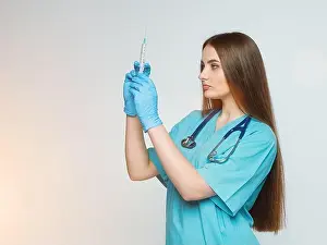 Needles Prints: a female doctor holds a syringe in her hand