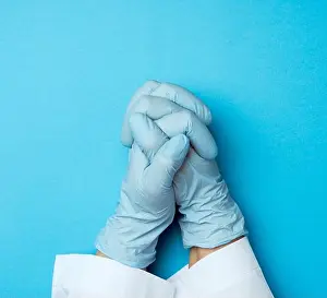 Sterile Prints: two female hands in a blue latex gloves