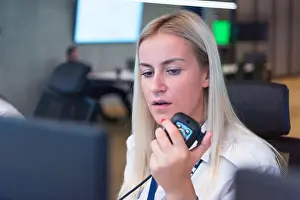 Woman Work Prints: Female security guard operator talking on the phone