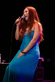Redhead Prints: Female singer, performing on stage