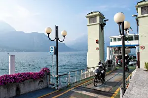 Ferry Prints: A ferry emptying passengers and cars into the village of Bellagio