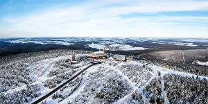 Fichtelberg highest mountain in Erzgebirge in winter snow aerial view photo panorama in Oberwiesenthal, Germany