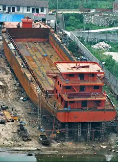 Shipyard Prints: FILE--A cargo ship is being built at a private shipyard on the bank of the Yangtze River in Yichang
