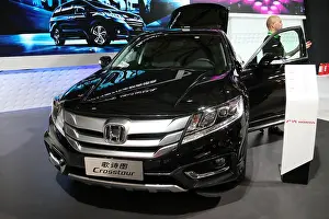 Honda Prints: FILE--A Honda Crosstour is displayed during the 2014 Pudong International Automotive Exhibition in Shanghai