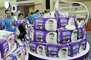 Diaper Prints: FILE--Bags of Anerle infant diapers of Hengan International Group are displayed at a fair in Fuzhou city