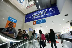 Retailing Prints: FILE--Chinese customers go shopping at a Wal-Mart Supercenter in Shanghai