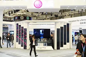 Home Appliance Prints: FILE--People visit the stand of LG during the Appliance & Electronics World Expo 2018 (AWE 2018) in Shanghai