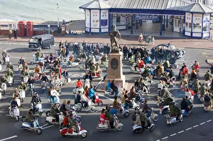 Filming Prints: Film extras ride along Eastbourne Seafront on scooters during the filming of Brighton Rock