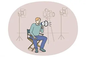 Megaphone Prints: Film producer sitting on chair screaming in megaphone at shooting