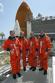 The final mission of Space Shuttle crew Atlantis pose for a picture on the launch pad of Kennedy Space Center
