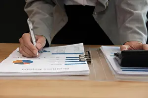 Advisor Prints: financial adviser working with calculator