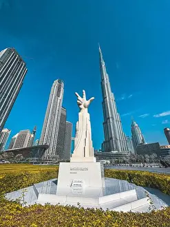 United Arab Emirates Prints: Three Fingers Statue in Burj Park surrounded by skyscrapers in Downtown Dubai