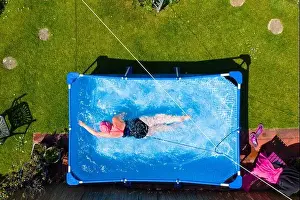 Fiona Philp from Limekilns, Fife, a wild open water swimmer, during a daily swim in pool in garden, Limekilns, Scotland, UK