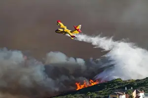 Firefighters Prints: Fire Fighting Aircraft attacking wild fire in southern Spain