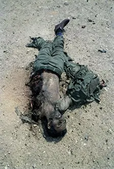 Highways Prints: First Gulf War: 4th March 1991 The dismembered body of an Iraqi soldier lies in the desert