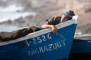 Siesta Prints: Fisher man sleeping in fishingboat, Taghazout, Morocco