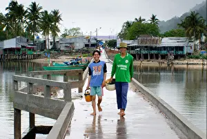 Bait Prints: Fishermen catch fish near the shore using nets