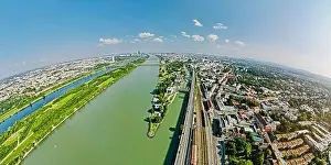 Fisheye Aerial drone view of Danube river in Vienna Austria cityscape with danube island