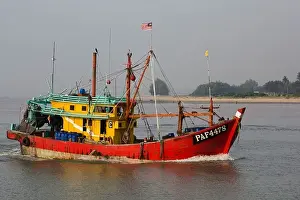Entering Prints: fishing boat entering the mouth of the Kuantan River early morning