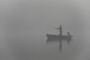 Rowboat Prints: Fishing early morning in a row boat on a foggy lake