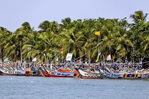 Fishing Village Prints: Fishing village of Ada Foah with brightly painted boats on the banks of the Volta River in the Greater Accra region of