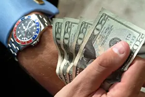 Wrist Prints: Fistful of US 20 Twenty Dollar Bills or notes and GMT Master Rolex Watch Chronomter