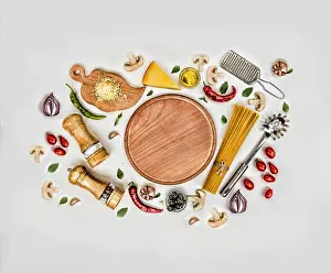Mushrooms Prints: Flat lay. Fettuccine and spaghetti with ingredients for cooking pasta on a white background