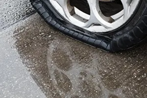Mode Of Transport Prints: Flat tire on wet road