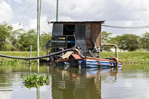 Water Pump Prints: Floating water pumps to transport water to flower farms, lake Naivasha, Kenya, East Africa