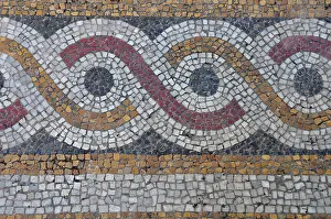 Floor mosaic background with circles pattern abstract geometric design on byzantine era church exterior