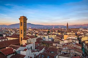 Florence, Italy historic cityscape with church bell towers at dusk