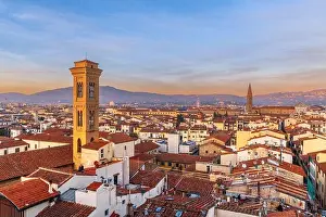 Florence, Italy historic cityscape with church bell towers at dusk