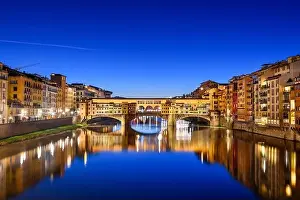 Florence, Italy at the Ponte Vecchio Bridge crossing the Arno River at twilight