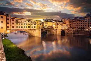 Florence, Italy at the Ponte Vecchio Bridge crossing the Arno River at twilight