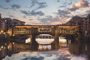 Florence, Italy at the Ponte Vecchio Bridge crossing the Arno River at twilight