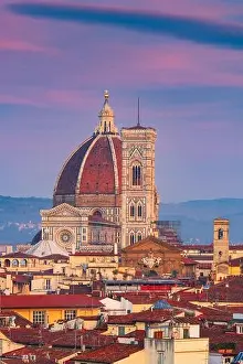 Florence, Italy skyline with landmark buildings at dusk over the Duomo