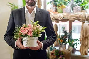 Bridegroom Prints: Flower box in male hands