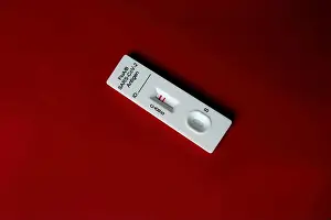 Detection Prints: Flu A test kit, influenza A positive isolated on red background