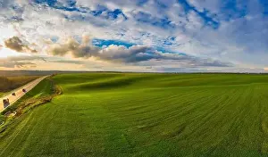 Wheat Field Prints: Flying over a field of growing wheat. Aerial panoramic drone shot